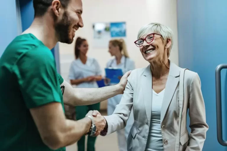 happy-senior-woman-shaking-hands-with-surgeon-hospital-hallway-1024x683-1